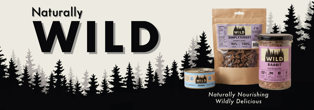 Naturally WILD. Naturally nourishing, wildly delicious. A pouch of Simply Turkey dog treats, a tin of tuna cat food and a jar of rabbit fresh dog food in front of a pine forest.